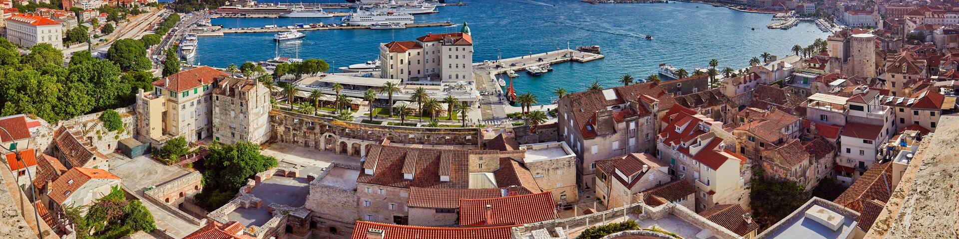 Split, Croatia. View of Split the second largest city of Croatia at dramatic sunlight. Shore of the Adriatic Sea and famous Palace of the Emperor Diocletian. Aerial view of Split coast