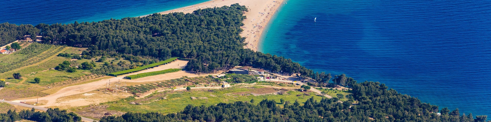 Zlatni Rat (Golden Cape or Golden Horn) famous turquoise beach in Bol town on Brac island, Dalmatia, Croatia. Zlatni Rat sandy beach at Bol on Brac island of Croatia in summertime.