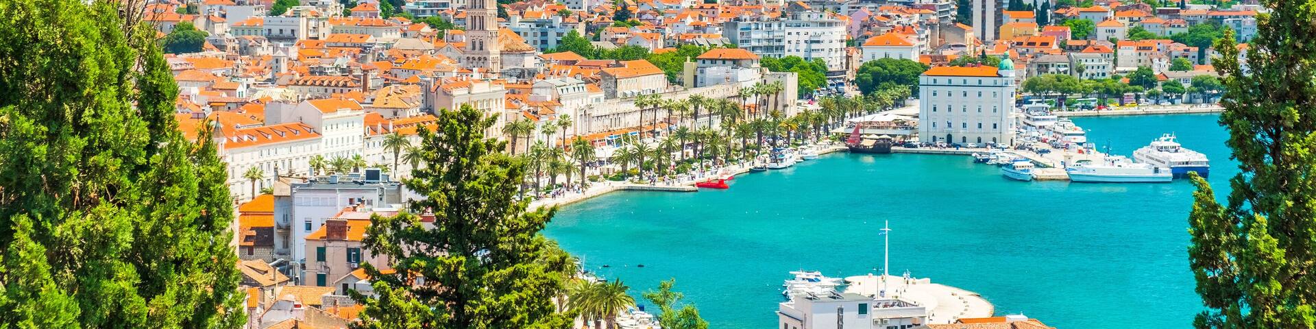 City of Split in Dalmatia, Croatia. City center, palace of Roman emperor Diocletian and cathedral, view through the pine trees. Popular tourist destination in Europe.
