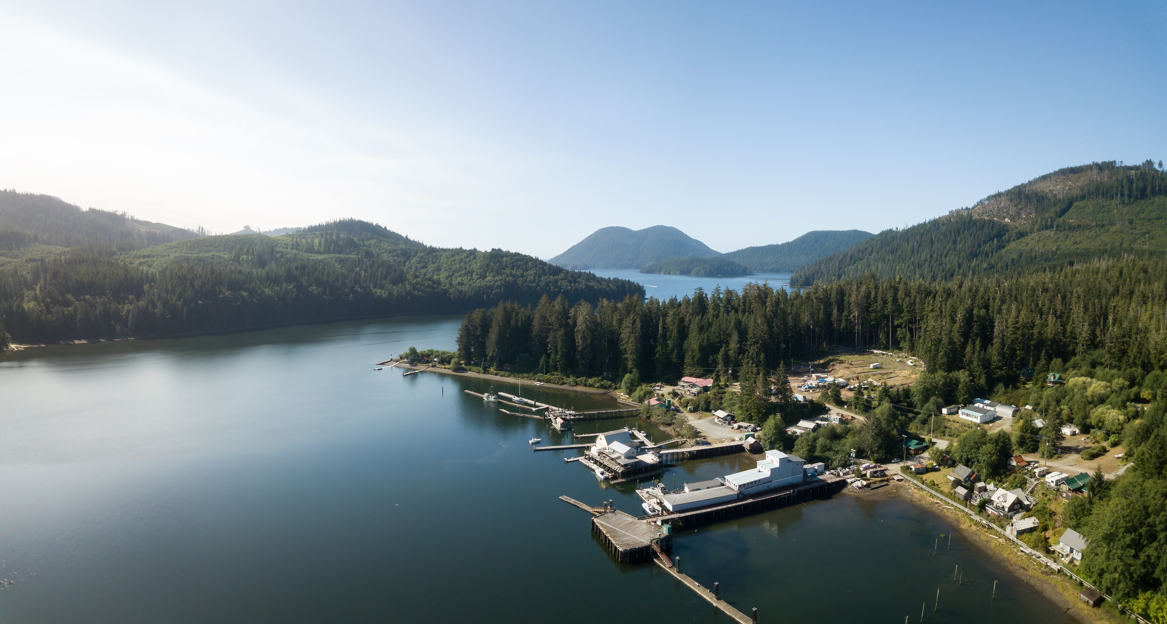 Aerial panoramic view of a little remote town, Winter Harbour, during a vibrant sunny summer day. Located in the Northern Vancouver Island, BC, Canada.