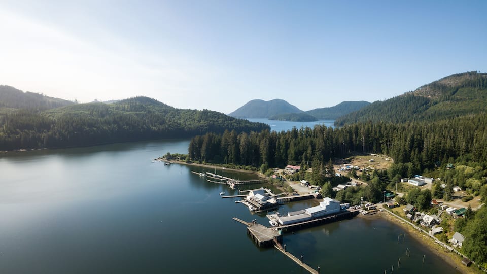 Aerial panoramic view of a little remote town, Winter Harbour, during a vibrant sunny summer day. Located in the Northern Vancouver Island, BC, Canada.