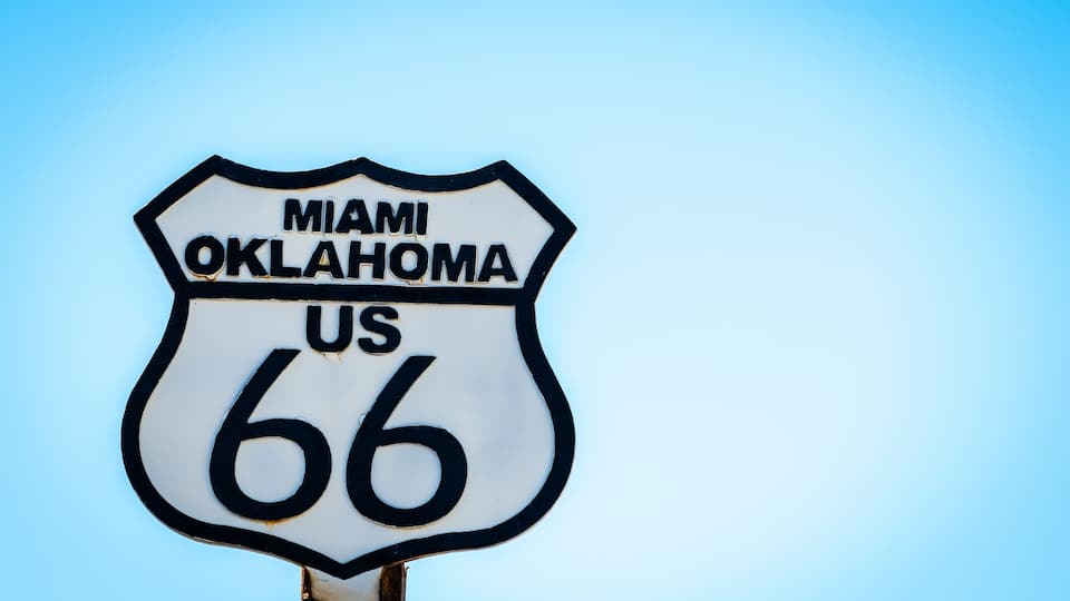 A sign for Miami to Oklahoma US 66.