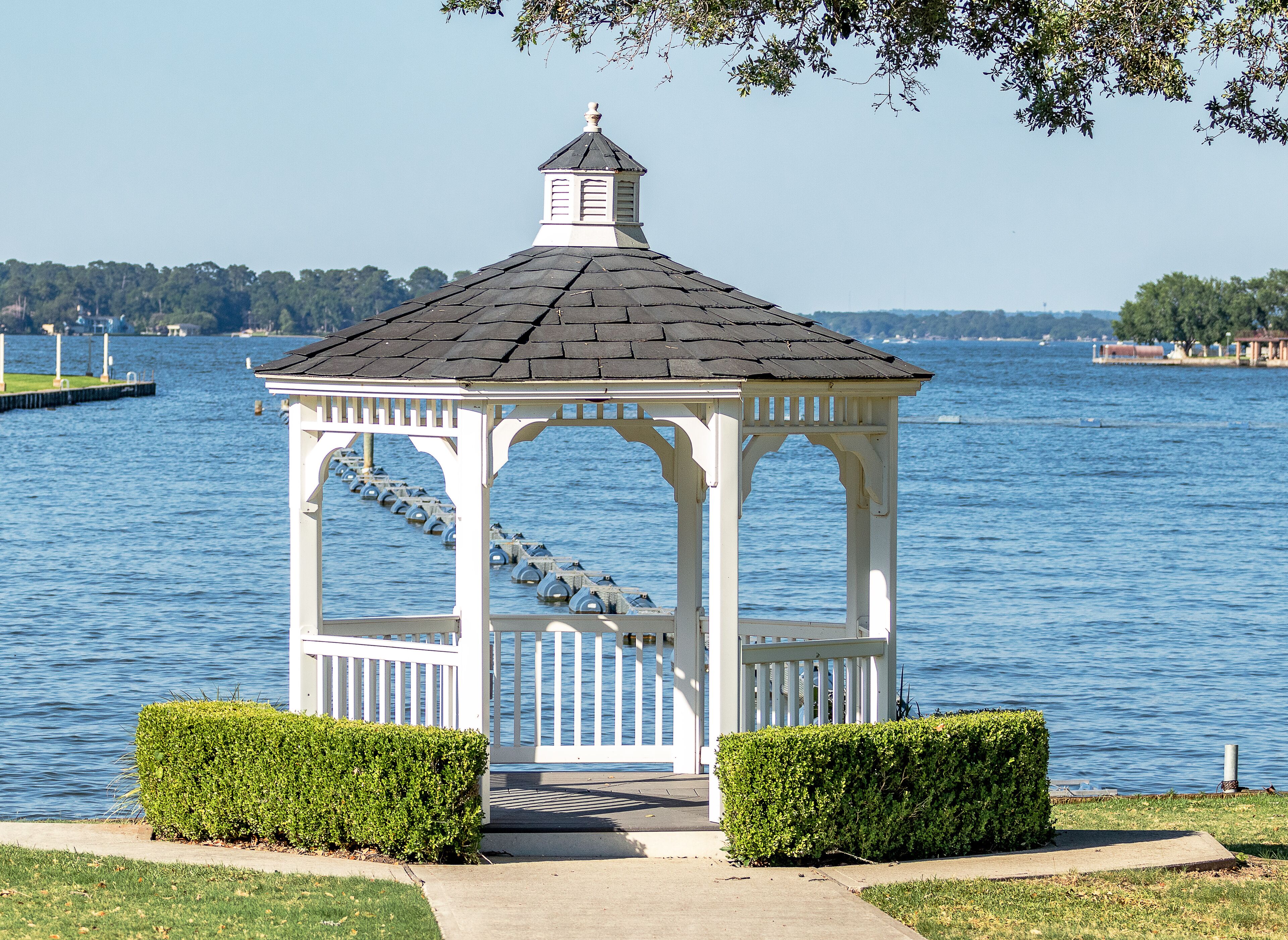 gazebo in the park next to the lake