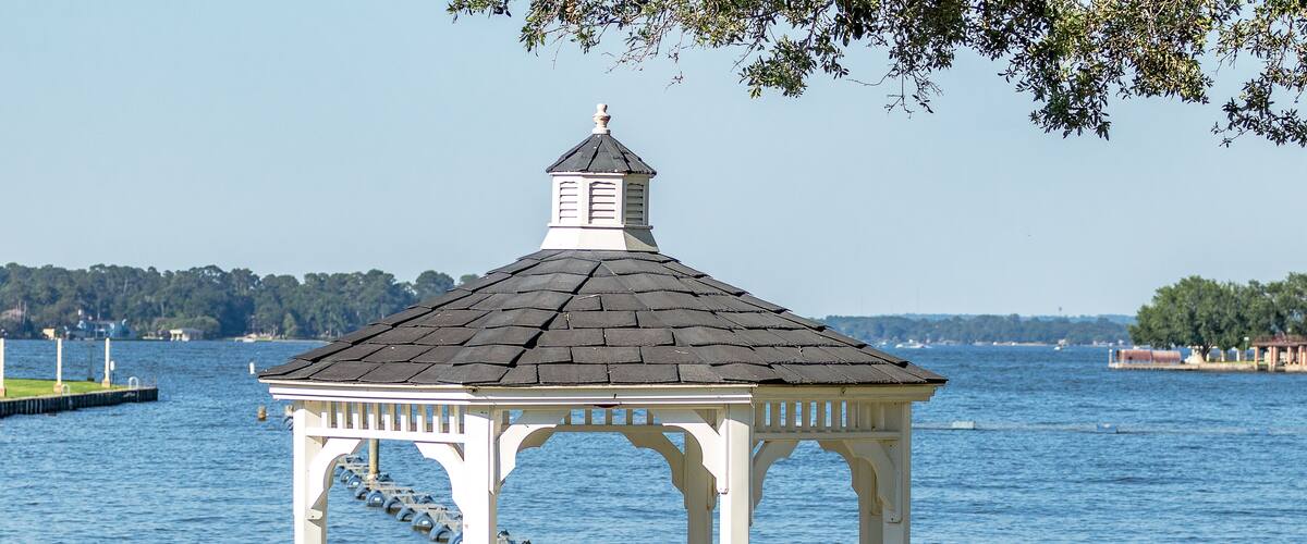 gazebo in the park next to the lake