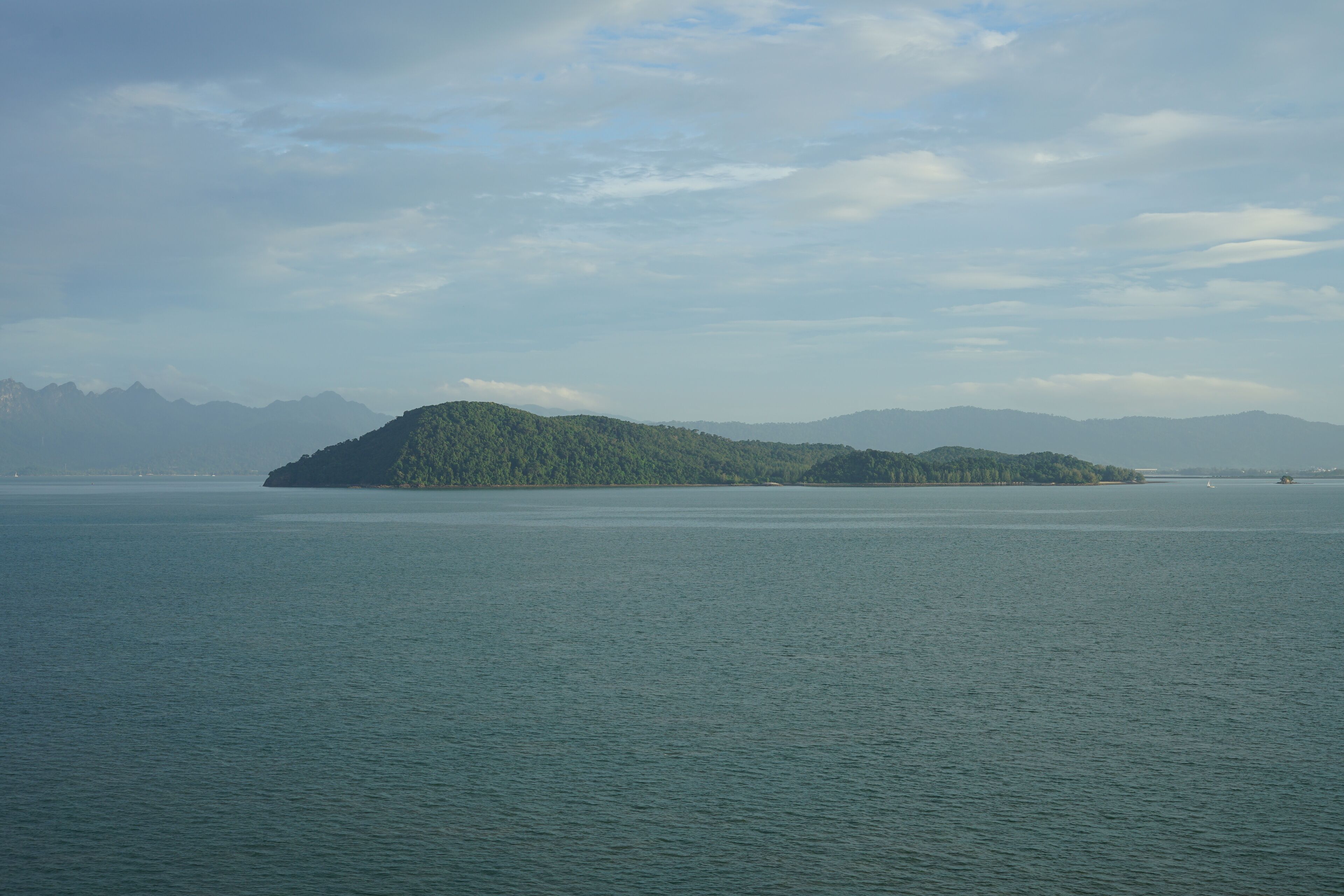 Malaysia, Langkawi, view of the island Pulau Rebak Besar and its lush green coastline of Kedawang as seen from a cruise ship