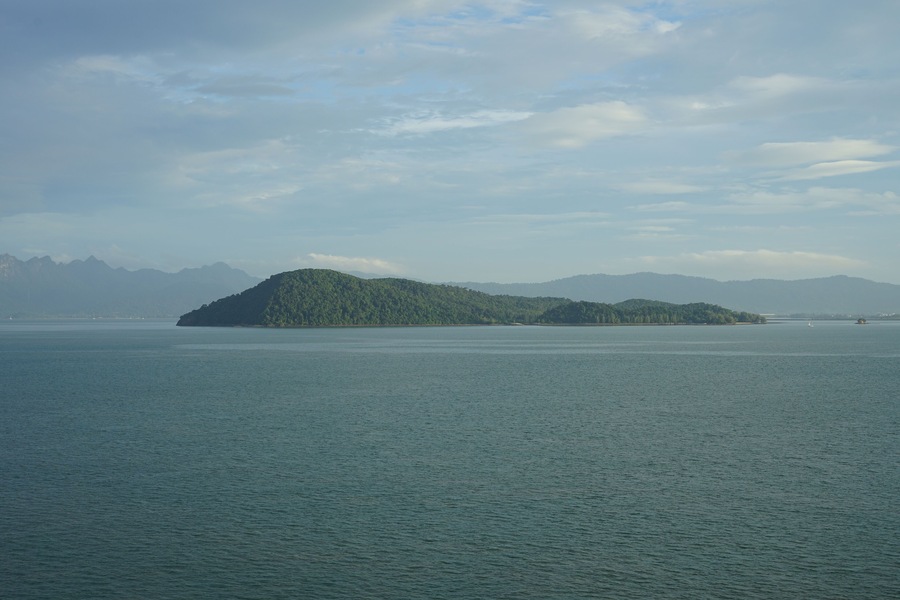 Malaysia, Langkawi, view of the island Pulau Rebak Besar and its lush green coastline of Kedawang as seen from a cruise ship