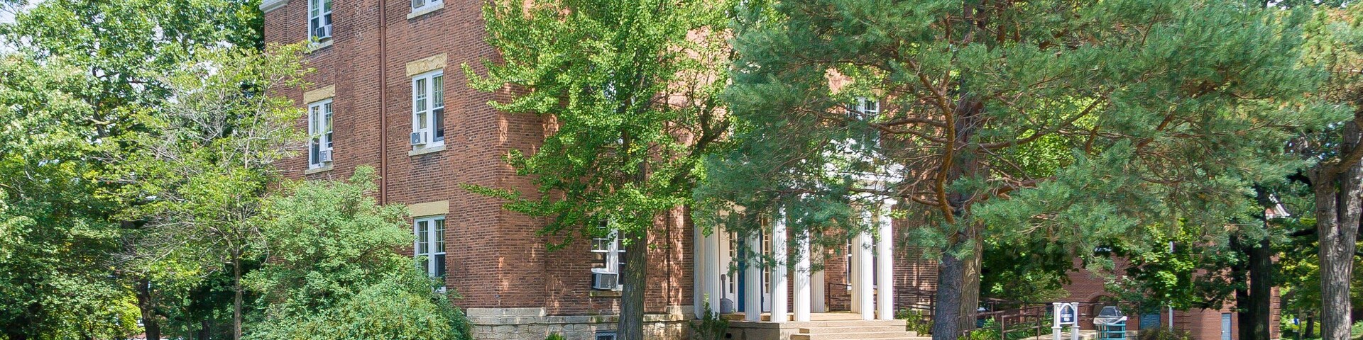 one of the buildings on the Beloit College campus surrounded by trees