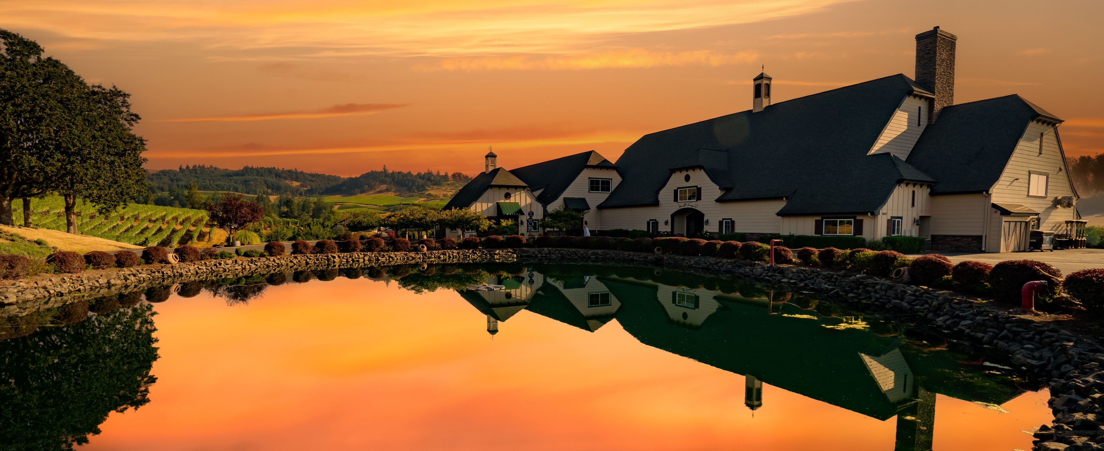 A winery and a reflection pond at sunrise near Salem Oregon, zenith