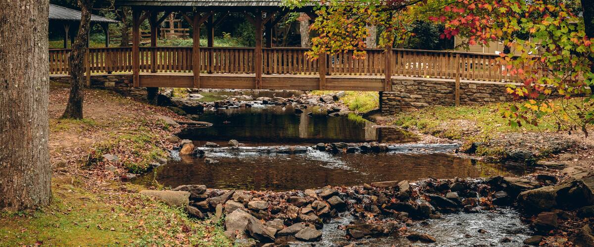 Covered bridge over creek during autumn, Fall foliage season at Vogel state park in Georgia mountains