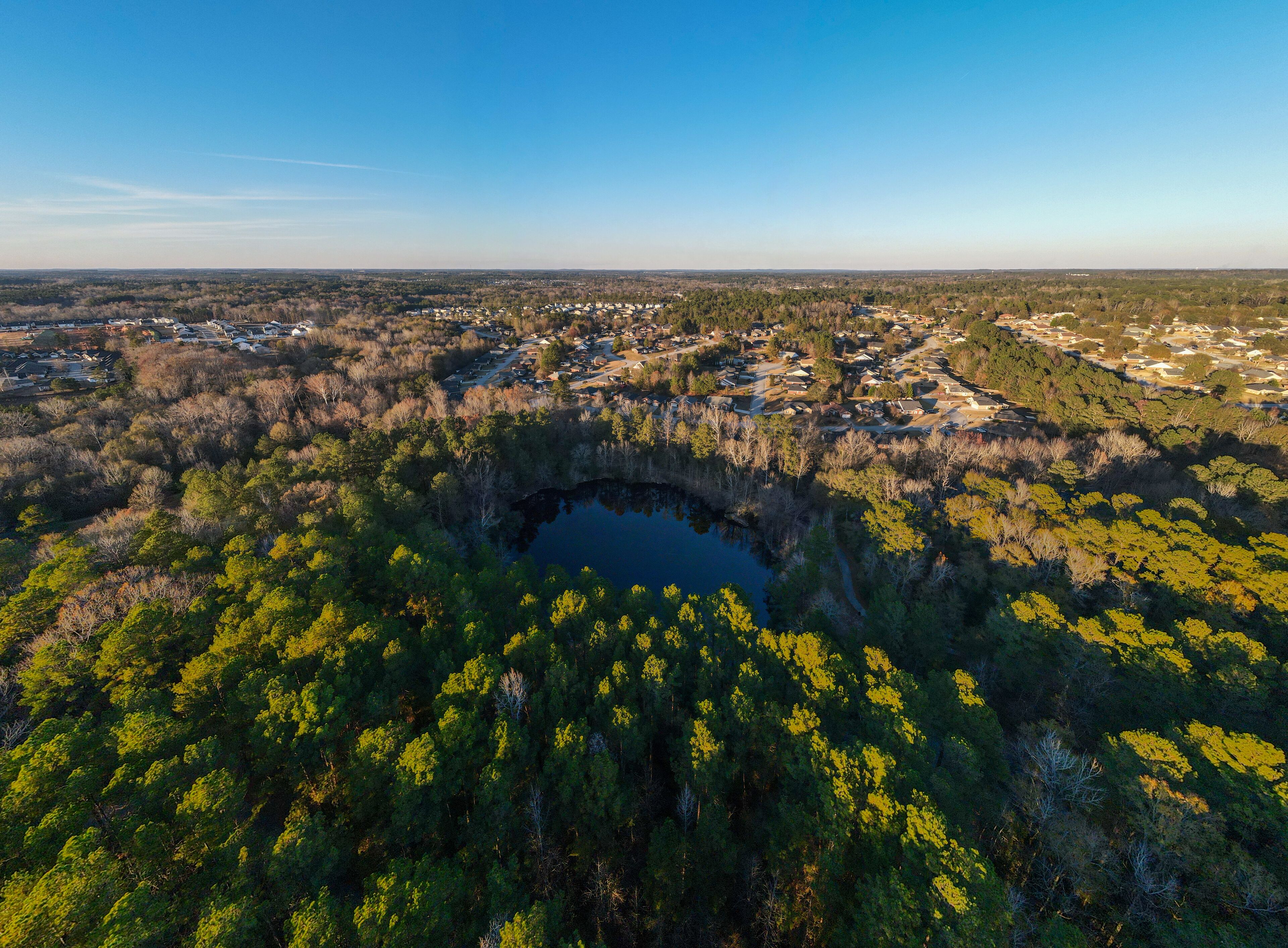Aerial landscape of pond at Euchee Creek Greenway Trail during Fall in Grovetown Augusta Georgia