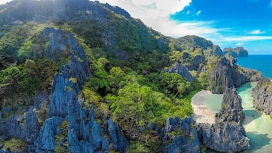 Aerial view of Hidden beach in Matinloc Island, El Nido, Palawan, Philippines - Tour C route - Paradise lagoon and beach in tropical scenery