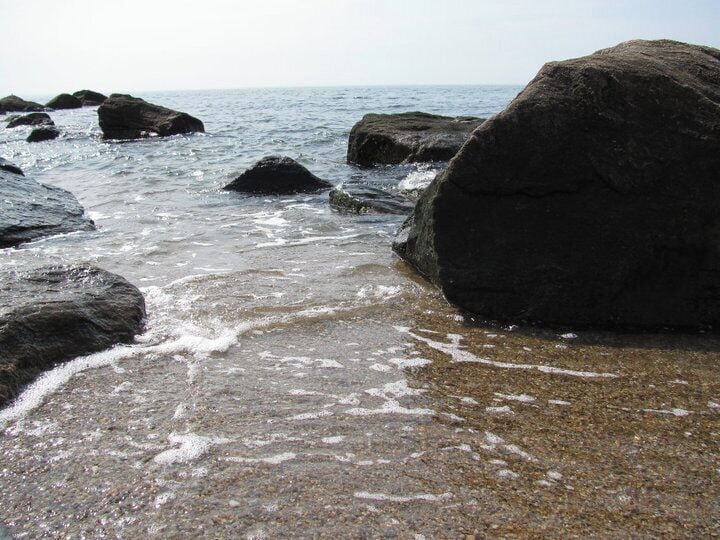 Wonderful views and in August the water was warm. The only downside? Jellyfish everywhere. So many that we couldn't go in the water at all. We ended up driving a mile west along the coast and the water there didn't have any jellyfish at all! While the tide was out you could walk out a few miles without the water going past your waist as well. But bring the sunscreen. Even if it's not that hot and the sun doesn't feel that bright, you burn. My friend and I were burnt to a crisp (and we both typically don't burn!)