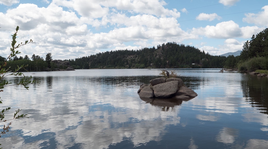 Clouds reflecting of the water of the beautiful private Lake Hiawatha in Red Feather Lakes, Colorado.