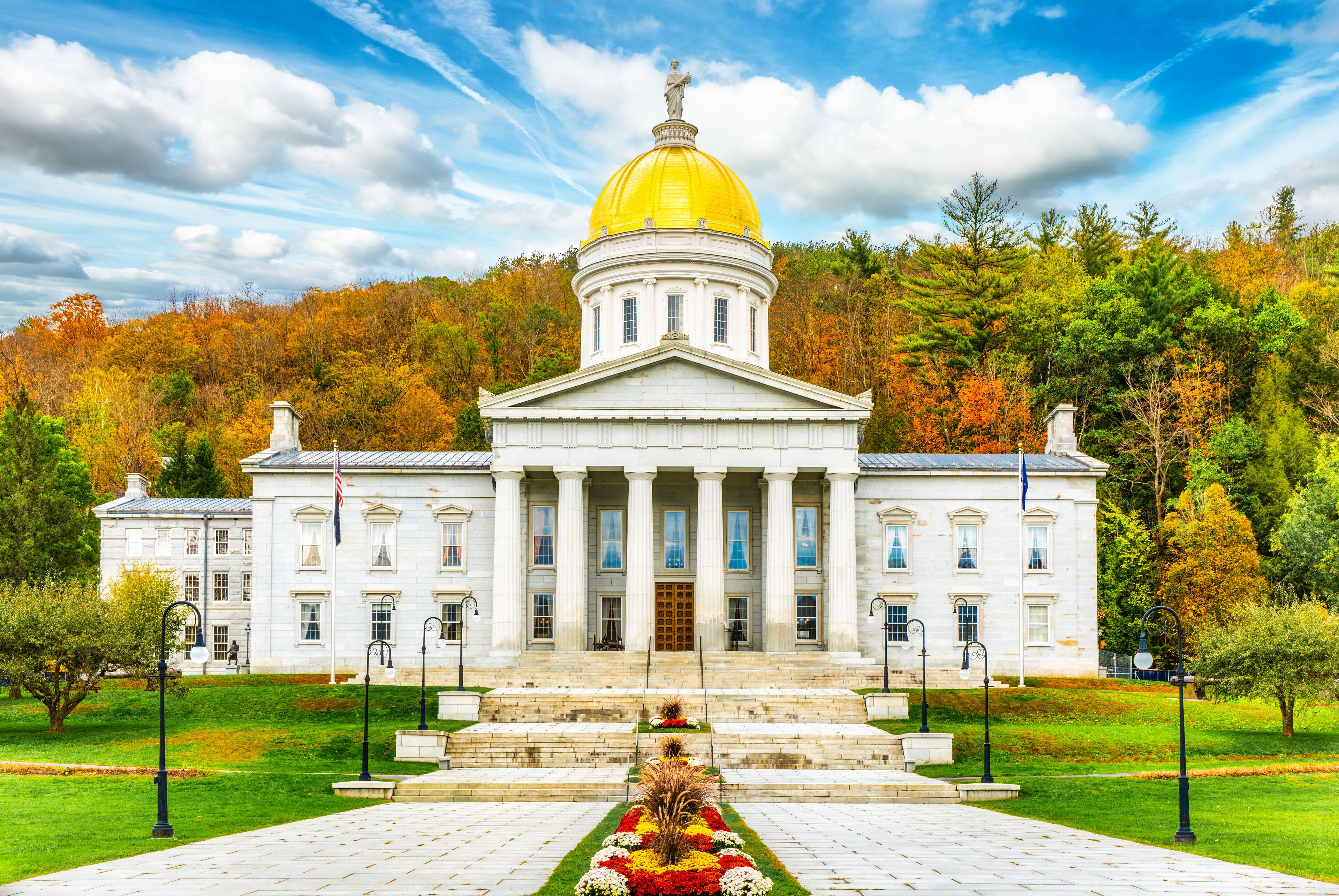 Frontal view of Vermont State House, in Montpelier, VT with fall foliage colors. This capitol is a public building and the seat of the Vermont General Assembly.