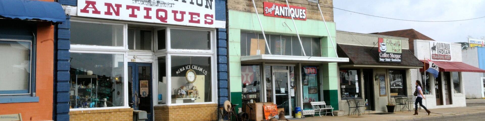 Mena showing shopping and a small town or village