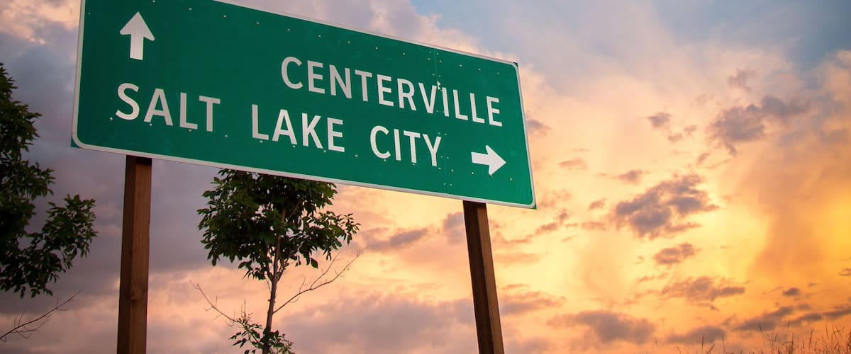 A road sign with directions to Centerville and Salt Lake City.