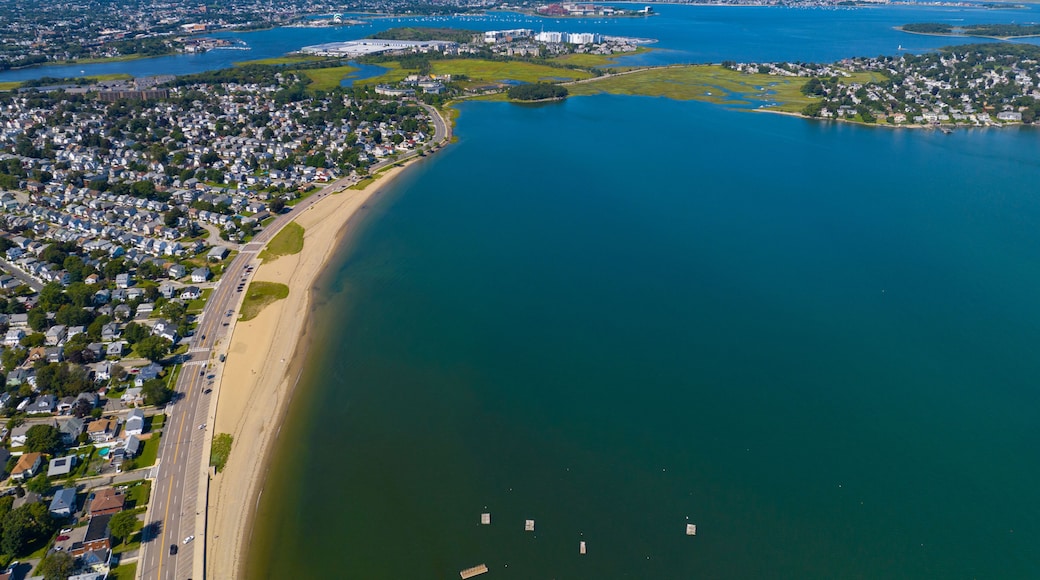 Wollaston Beach aerial view and Quincy Shore Drive next to the beach in Quincy Bay with Boston modern skyline at the background in Wollaston, city of Quincy, Massachusetts MA, USA.