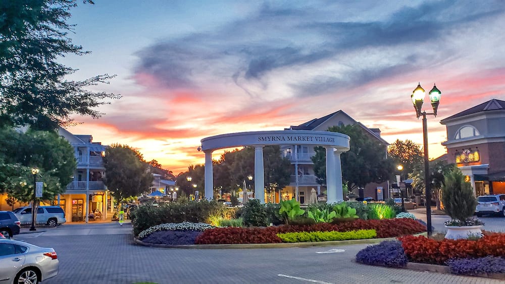 Downtown Smyrna Georgia. Downtown Smyrna Georgia taken at sunset from the street. Shopping and restaurants within an idyllic setting of flowers