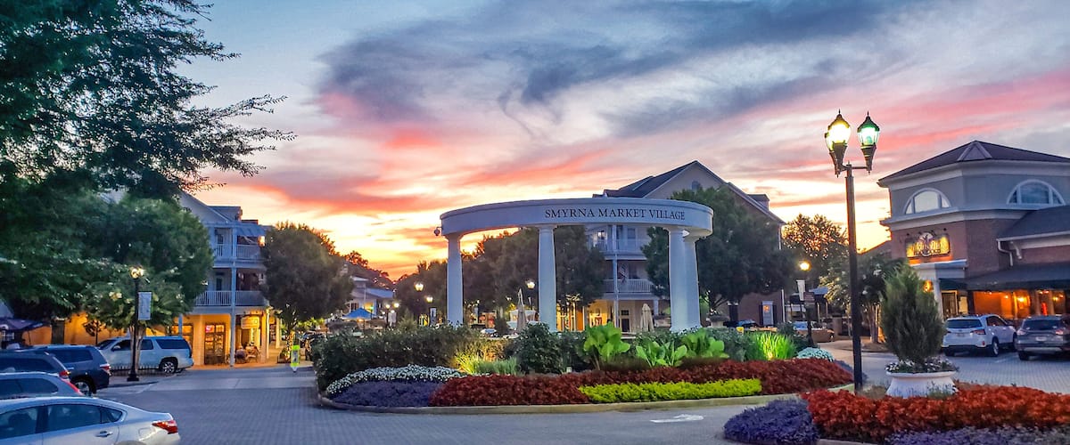 Downtown Smyrna Georgia. Downtown Smyrna Georgia taken at sunset from the street. Shopping and restaurants within an idyllic setting of flowers