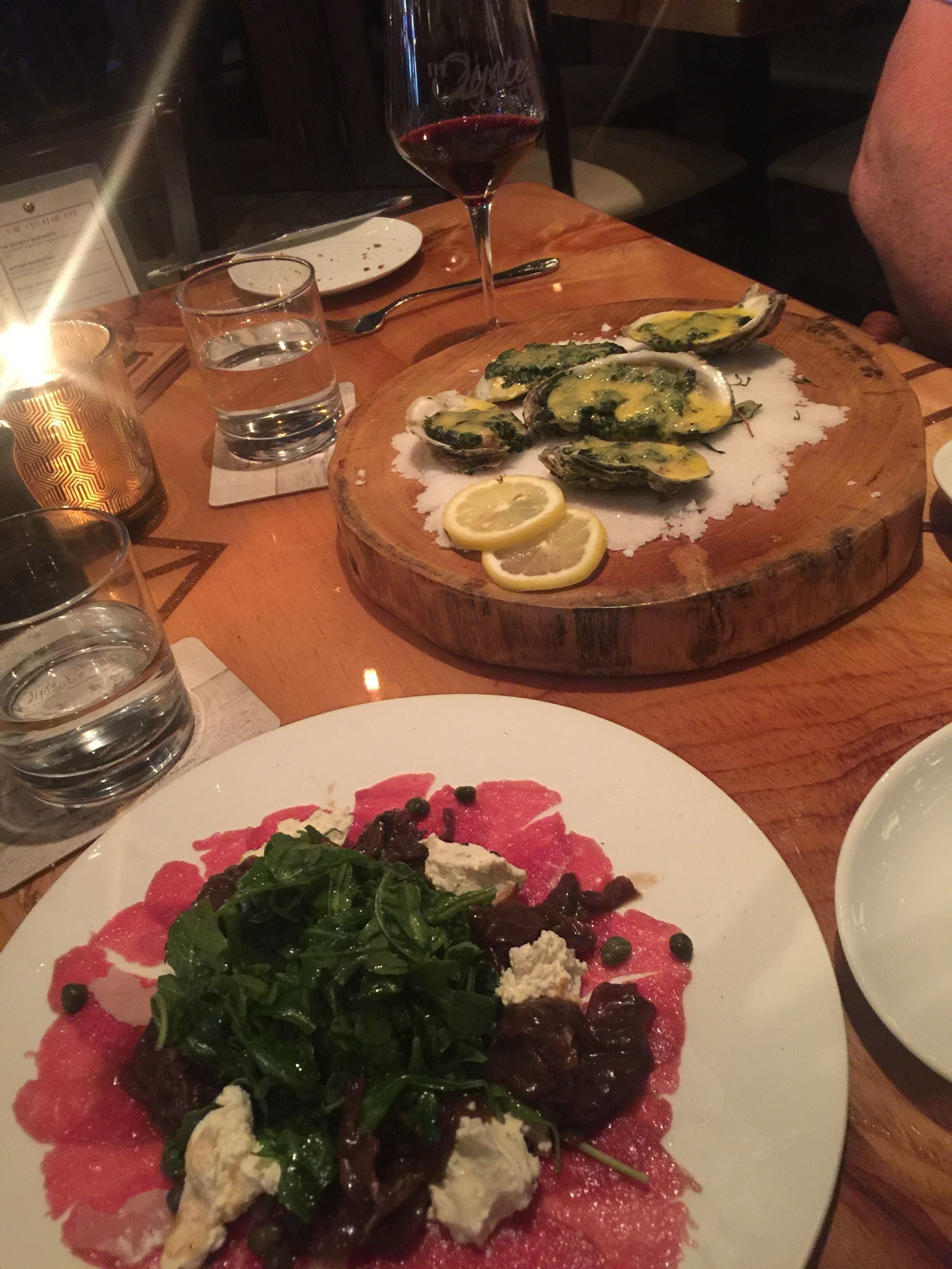 The Oyster Society in Marco Island is a great place to enjoy oysters and fresh cuisine with a glass of red wine.