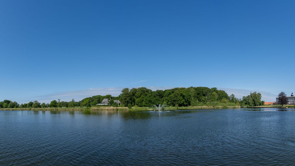 panorama view of the Maribo Lake in Denmark with the Sopark Hotel on the lakeside