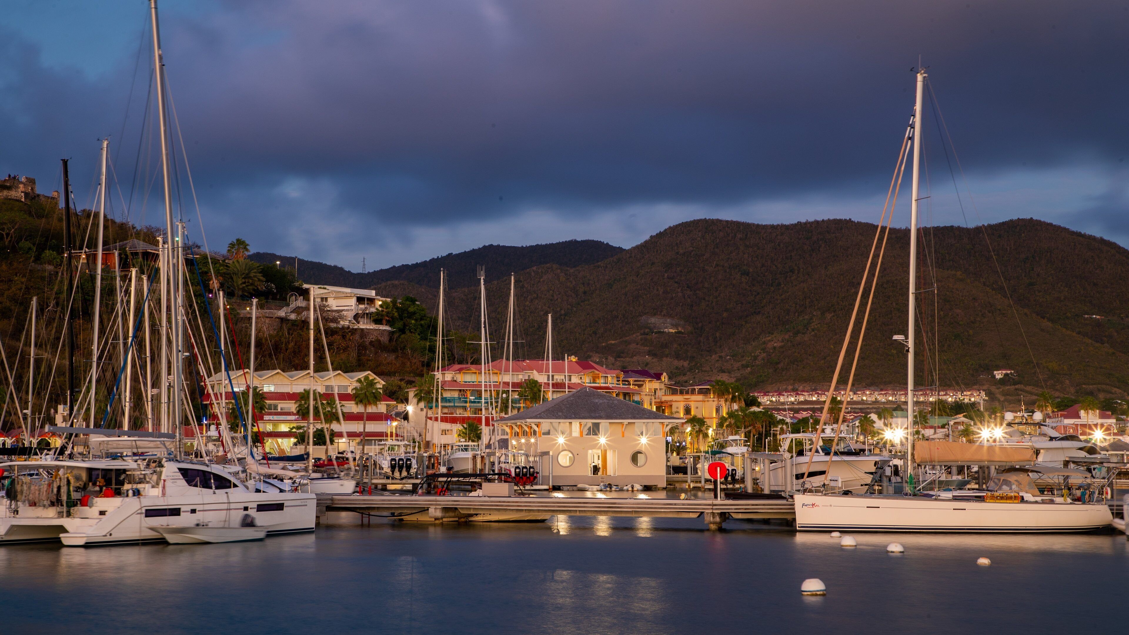 Marigot showing a bay or harbor and night scenes