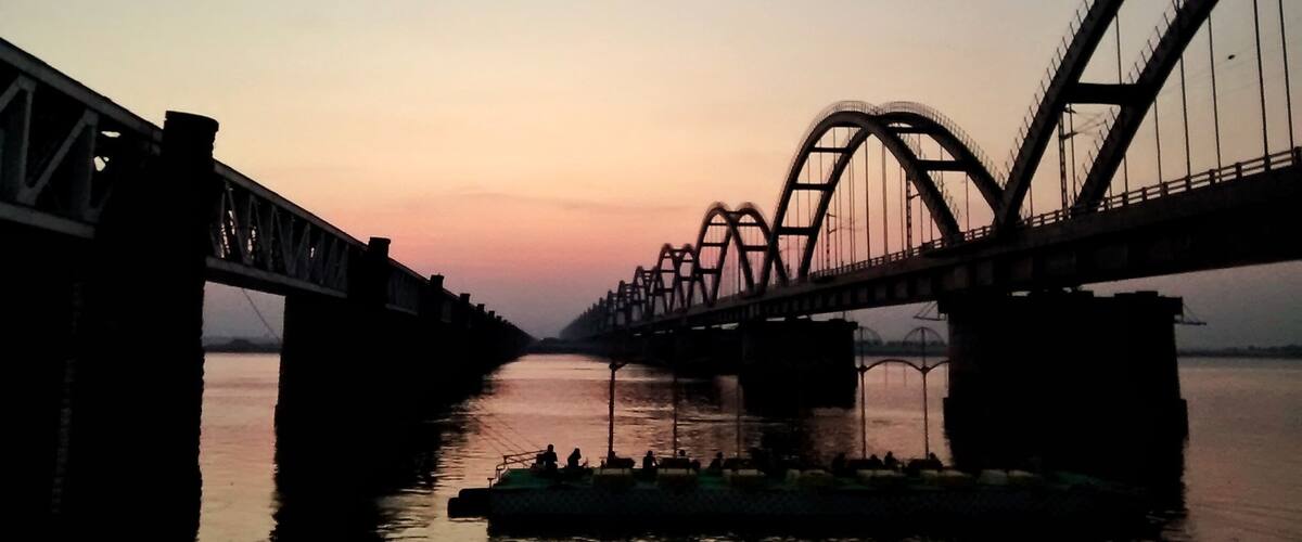 A bridge with a distinctive arch design spanning over a river.