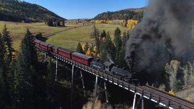 The Cumbres & Toltec is a 3 ft narrow-gauge scenic railroad running for 64 miles between Antonito, Colorado and Chama, New Mexico. Fall scenic tours book fast, plan ahead if you want to catch a ride! #ADVENTURE
