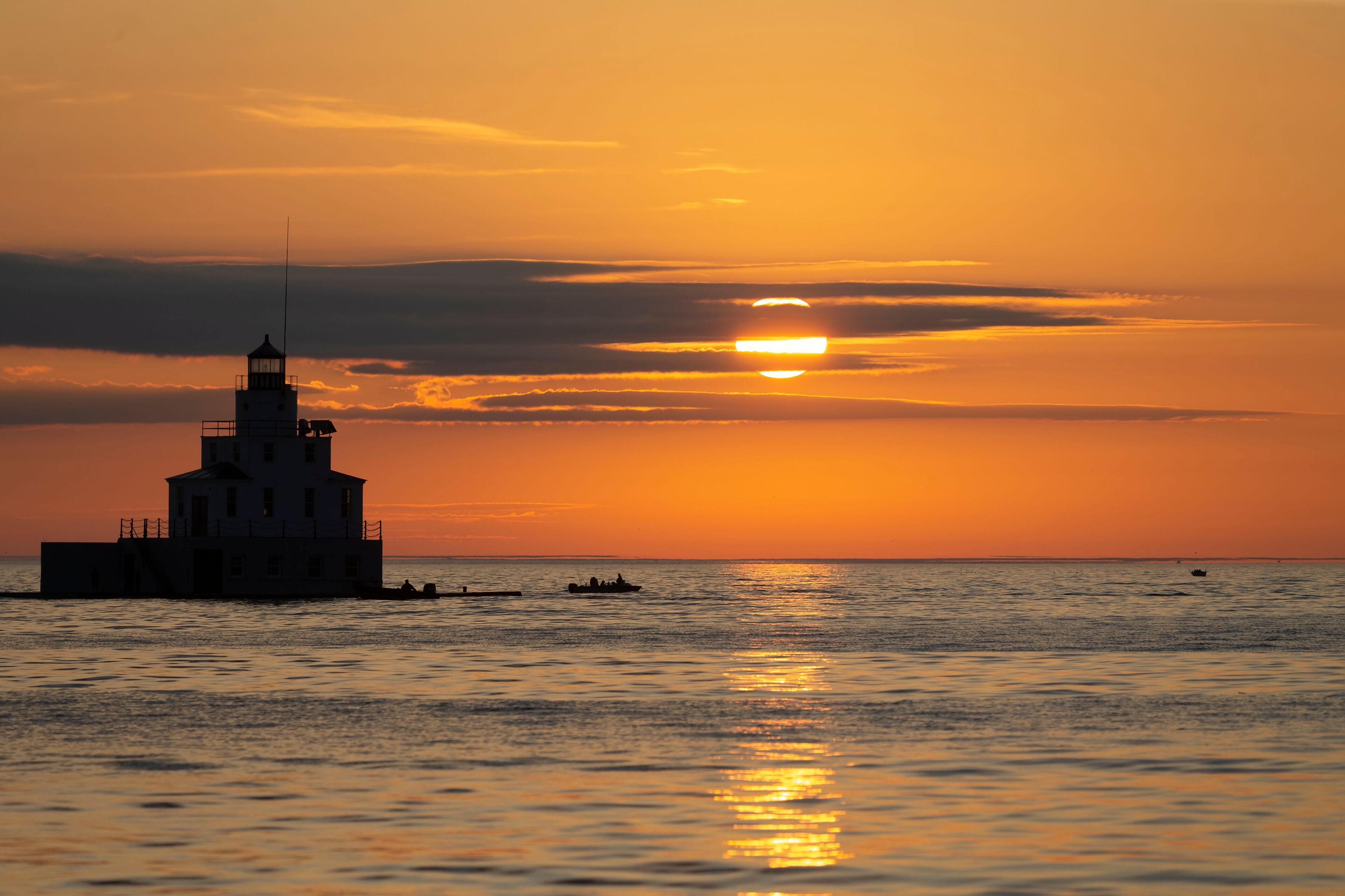 sunrise over lake and mouth of Manitowoc river Lighthouse at Manitowoc Harbor on Lake Michigan in Wisconsin
