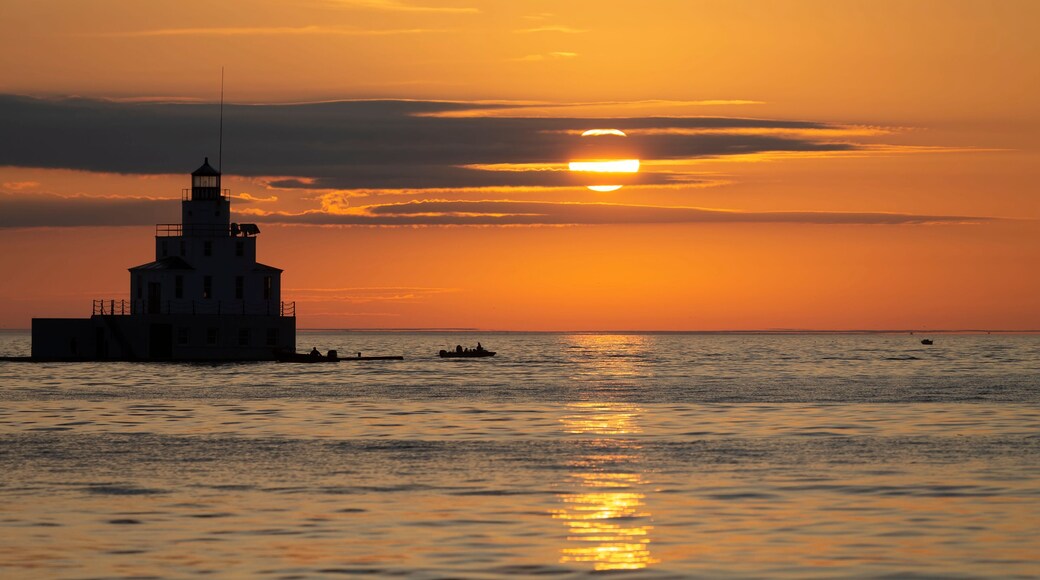 sunrise over lake and mouth of Manitowoc river Lighthouse at Manitowoc Harbor on Lake Michigan in Wisconsin