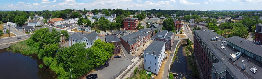 Methuen downtown including Spicket Mill at Spicket River aerial view at Pleasant Street and Broadway in historic city center of Methuen, Massachusetts MA, USA.