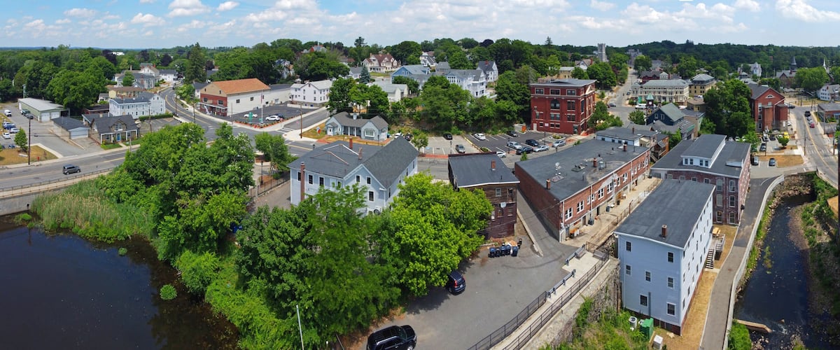 Methuen downtown including Spicket Mill at Spicket River aerial view at Pleasant Street and Broadway in historic city center of Methuen, Massachusetts MA, USA.