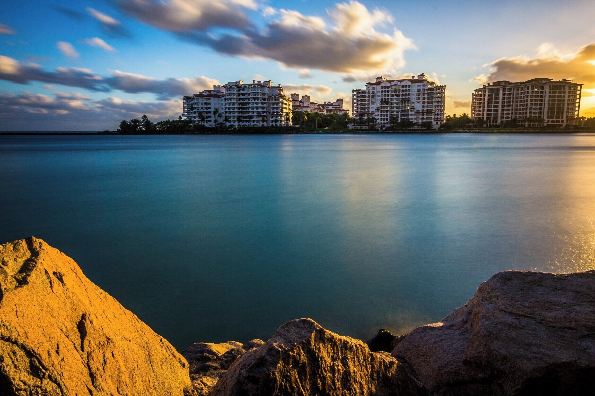 Took this picture of Fisher Island from the walkway to South Point pier in Miami Beach, Florida. The pier is about 800 feet to the left. The water in the pic is of Government Cut. This is a shipping lane for both transport and commercial large ships and a means of getting into the Atlantic Ocean. Parking at this location varies according to weekends and tourist season.  This park provides an excellent opportunity for capturing people and both architectural and landscape pics. Highly recommend it to all. Always, it is a wise decision to bring a friend along specially during night hours.