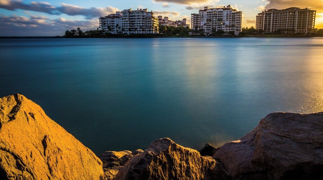 Took this picture of Fisher Island from the walkway to South Point pier in Miami Beach, Florida. The pier is about 800 feet to the left. The water in the pic is of Government Cut. This is a shipping lane for both transport and commercial large ships and a means of getting into the Atlantic Ocean. Parking at this location varies according to weekends and tourist season. This park provides an excellent opportunity for capturing people and both architectural and landscape pics. Highly recommend it to all. Always, it is a wise decision to bring a friend along specially during night hours.