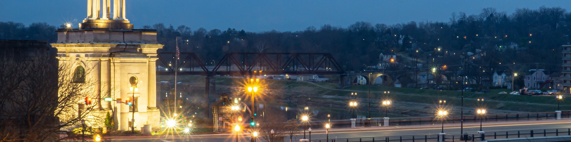 The Hamilton, Ohio Butler County Monument and the Great Miami River bridge at night.