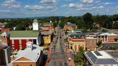 Low aerial view of main street usa, Charles Town, West Virginia, WV on a beautiful sunny day.