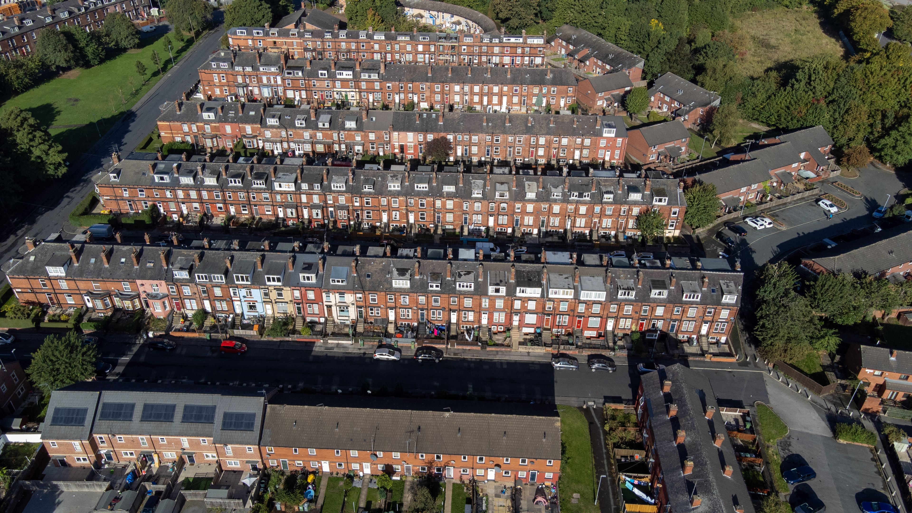Aerial photo of the village of the town of Hunslet in Leeds West Yorkshire in the UK, showing roads and rows of residential houses, taken in the summer time.