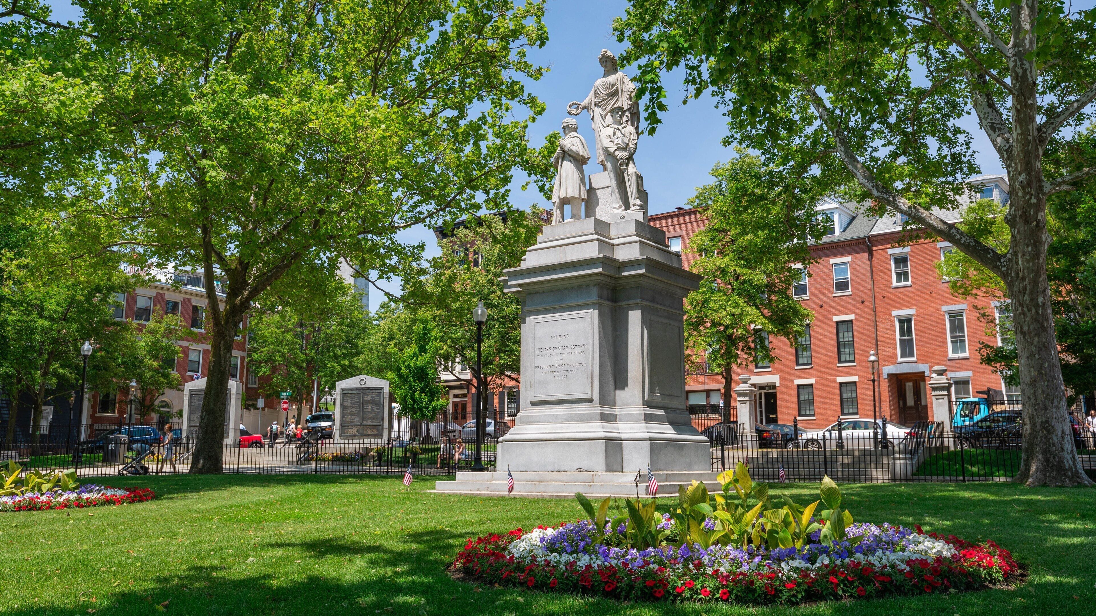 Charlestown which includes a garden, flowers and a statue or sculpture