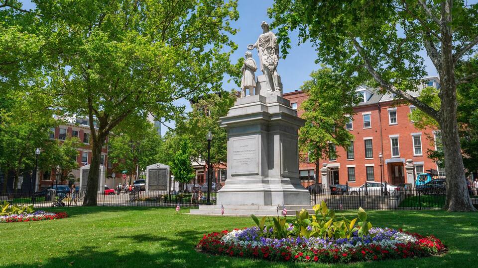 Charlestown which includes a garden, flowers and a statue or sculpture