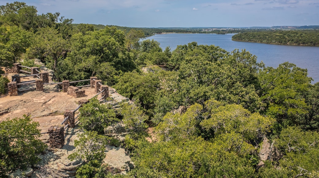Aerial Drone View of Blue Lake Surrounded by Forest of Green Trees With Rocky Landscape in Lake Mineral Wells State Park in Mineral Wells, Texas