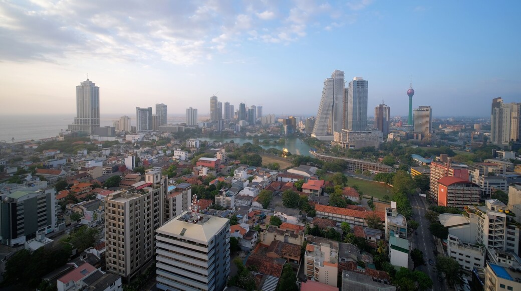 Colombo cityscape with view of Beira Lake surrounded by ny large businesses, condos and Lotus Tower