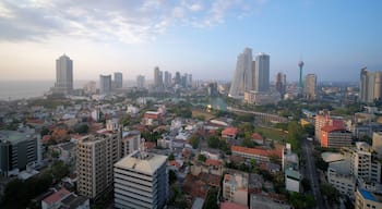 Colombo cityscape with view of Beira Lake surrounded by ny large businesses, condos and Lotus Tower