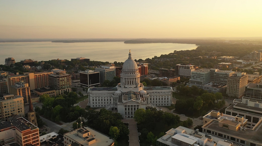 Aerial view of City of Madison. The capital city of Wisconsin from above. Drone flying over Wisconsin State Capitol in downtown. Sunny morning, sunrise (sunset), sunlight, summertime
