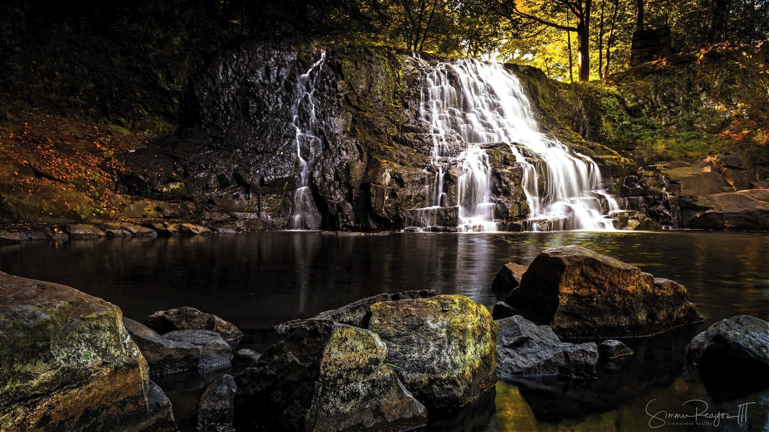 This photo was taken during a nice fall weekend.  The water level was low enough to cross to the other side to capture the falls from a different angle than most.  Best time however is early morning before most people get there.