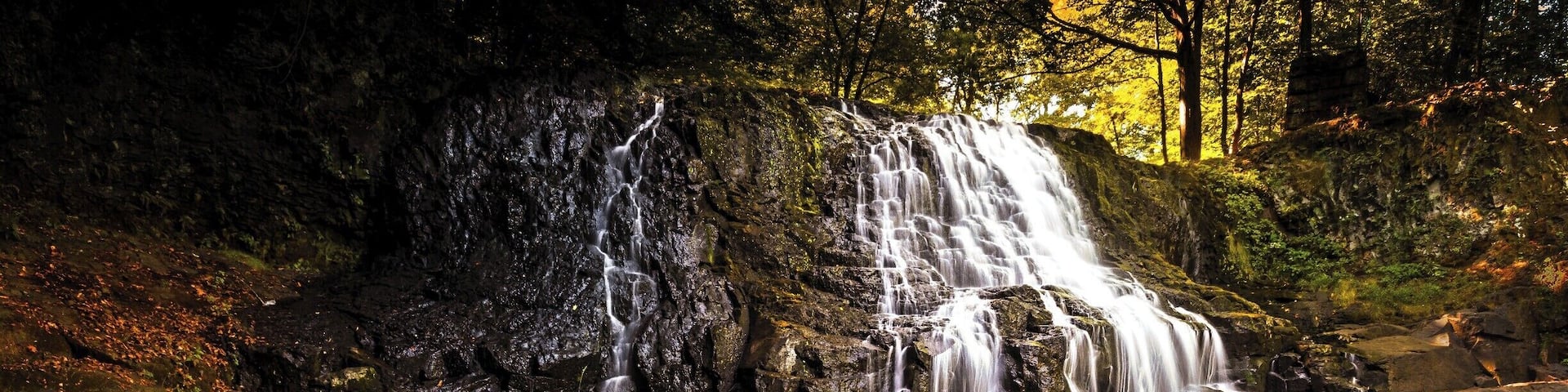 This photo was taken during a nice fall weekend. The water level was low enough to cross to the other side to capture the falls from a different angle than most. Best time however is early morning before most people get there.