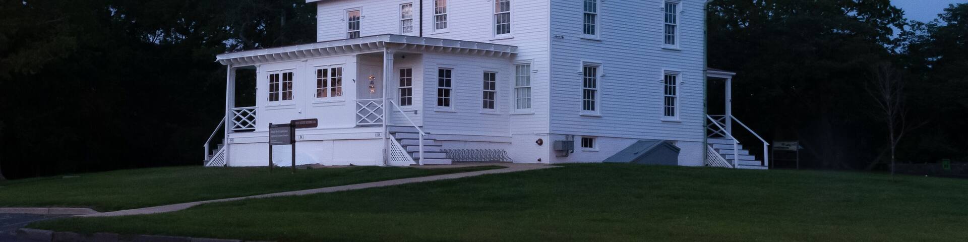 Sandy Hook Lighthouse is seen during twilight in August of 2024
