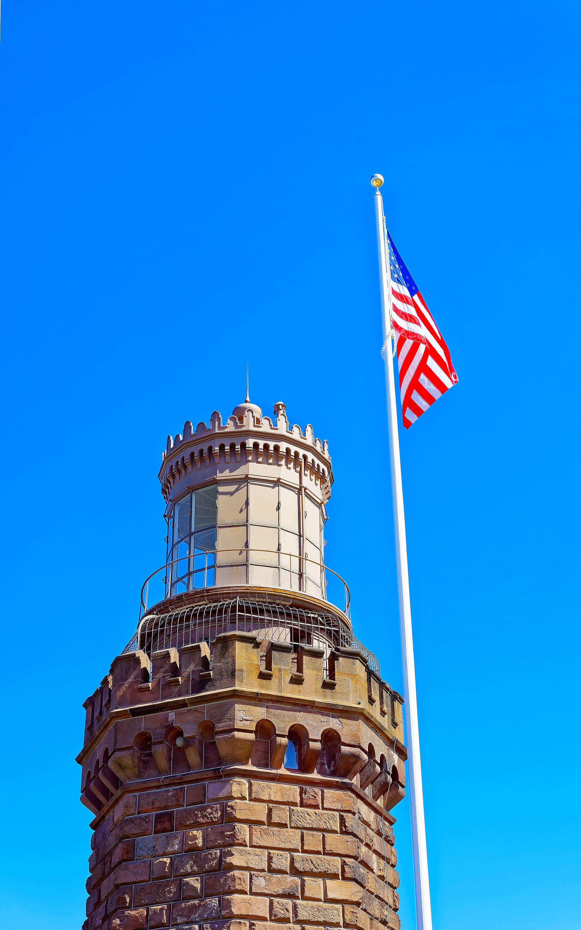 Navesink Twin Lights and flag at Sandy Hook in NJ reflex