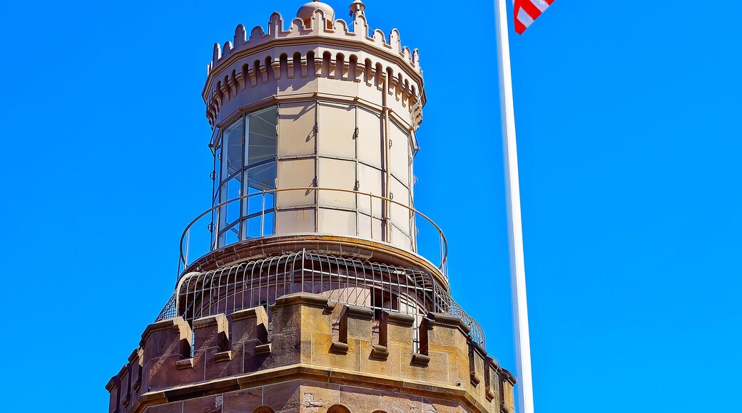Navesink Twin Lights and flag at Sandy Hook in NJ reflex