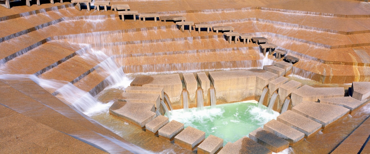 A terraced water feature with multiple levels and benches.