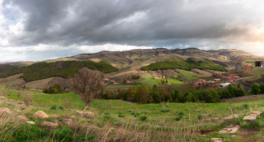 landscape photo in mountains with beautiful sky and trees in roman town Cuicul at village Djemila, Algeria